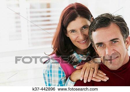 40-45 year old Caucasian couple relaxing in living room View Large Photo Image Stock Photograph - 40-45 year old Caucasian couple relaxing in living room. Fotosearch