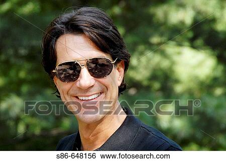 40-45 year old caucasian male, wearing sunglasses View Large Photo Image Stock Photograph - 40-45 year old caucasian male, wearing sunglasses. Fotosearch