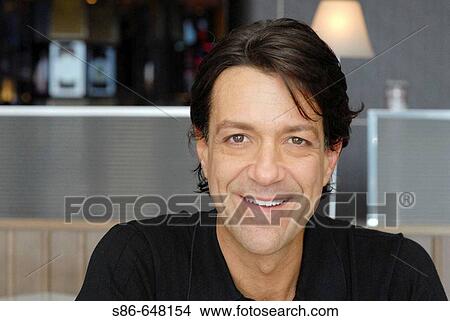 40-45 year old white male, seated in a bar/caf? View Large Photo Image Picture - 40-45 year old white male, seated in a bar/caf?. Fotosearch