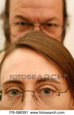 40 year old woman with man behind her View Large Photo Image Stock Image - 40 year old woman with man behind her. Fotosearch