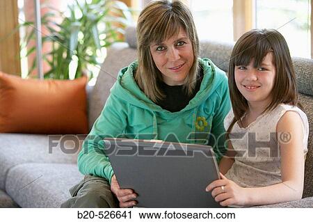 Stock Image - 40 years old mother and 9 years old daughter. Gipuzkoa, Euskadi. Spain.. Fotosearch
