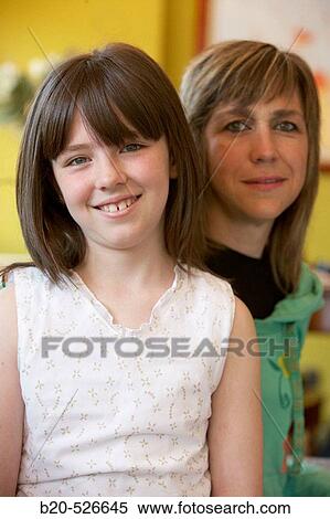 Stock Photography - 40 years old mother and 9 years old daughter. Gipuzkoa, Euskadi. Spain.. Fotosearch
