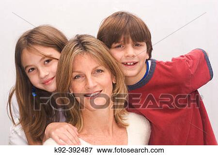 44 year old mother and her 10 year old daughter and 7 year old son View Large Photo Image Stock Photo - 44 year old mother and her 10 year old daughter and 7 year old son. Fotosearch