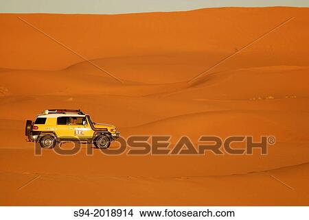4X4 in the desert of Erg Chebbi desert near Merzouga, southeast Morocco. View Large Photo Image Picture - 4X4 in the desert of Erg Chebbi desert near Merzouga, southeast Morocco.. Fotosearch