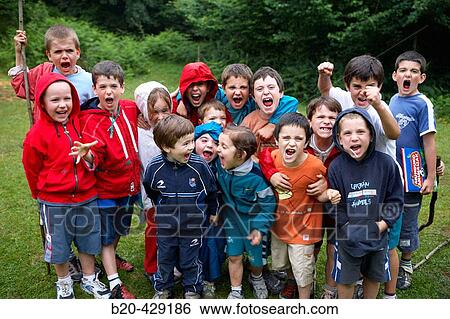 Stock Photograph - 5 and 8 year old friends, birthday party. Fotosearch