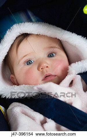 5 month old baby girl lying in car seat, headshot View Large Photo Image Picture - 5 month old baby girl lying in car seat, headshot. Fotosearch