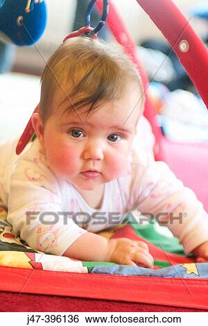 5 month old baby girl on tummy, serious View Large Photo Image Stock Photograph - 5 month old baby girl on tummy, serious. Fotosearch