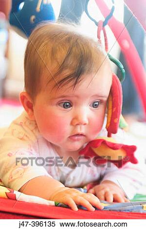 5 month old baby girl on tummy, serious View Large Photo Image Stock Photography - 5 month old baby girl on tummy, serious. Fotosearch