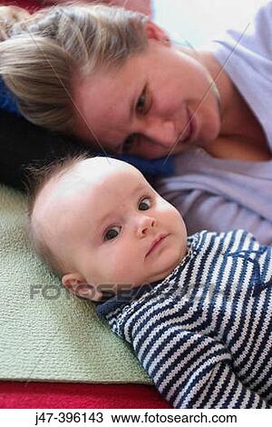5 month old baby lying in front of mother View Large Photo Image Stock Image - 5 month old baby lying in front of mother. Fotosearch