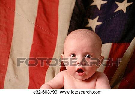 Stock Photo - 5 month old baby portrait with american flag background. Fotosearch