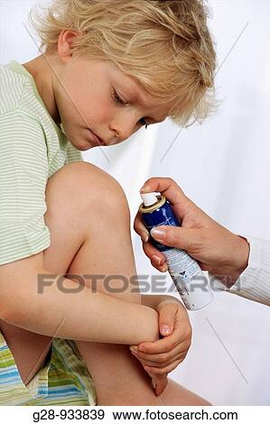 5 year old boy and doctor spraying clean a bruise View Large Photo Image Stock Photo - 5 year old boy and doctor spraying clean a bruise. Fotosearch