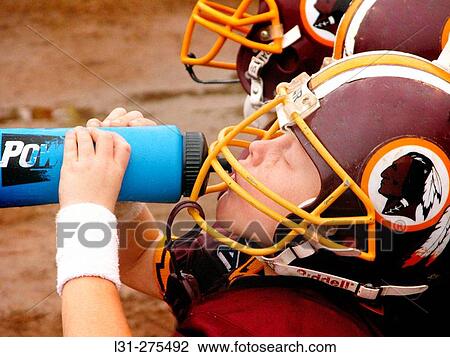 5 Year old boy drinking water at full contact football game View Large Photo Image Stock Image - 5 Year old boy drinking water at full contact football game. Fotosearch