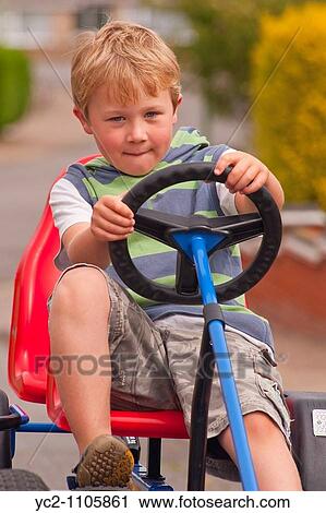 5 year old boy on a Berg go cart in the Uk View Large Photo Image Stock Image - 5 year old boy on a Berg go cart in the Uk. Fotosearch
