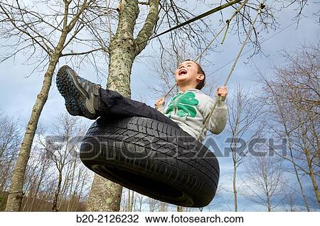 5 year old boy on swing. Gipuzkoa. Basque Country. Spain. View Large Photo Image Stock Image - 5 year old boy on swing. Gipuzkoa. Basque Country. Spain.. Fotosearch