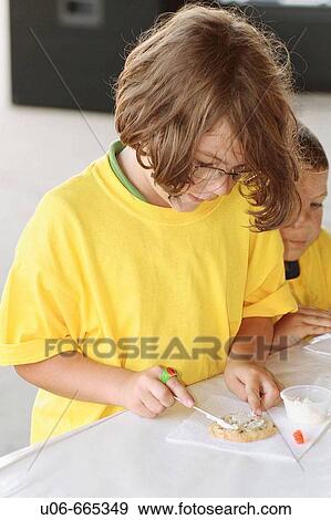 5 year old girl coloring a cookie View Large Photo Image Stock Photo - 5 year old girl coloring a cookie. Fotosearch