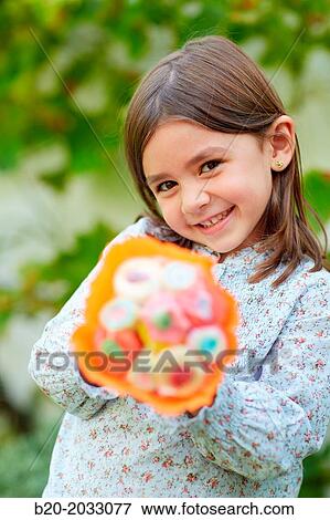5 year old girl with treats. Donostia. San Sebastian. Gipuzkoa. Basque Country. Spain. View Large Photo Image Stock Photo - 5 year old girl with treats. Donostia. San Sebastian. Gipuzkoa. Basque Country. Spain.. Fotosearch