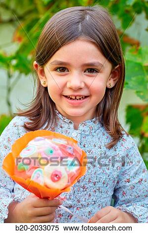 5 year old girl with treats. Donostia. San Sebastian. Gipuzkoa. Basque Country. Spain. View Large Photo Image Stock Photography - 5 year old girl with treats. Donostia. San Sebastian. Gipuzkoa. Basque Country. Spain.. Fotosearch