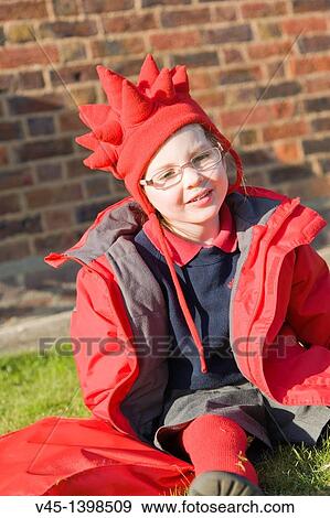Stock Photo - 5 years old tired girl in school uniform resting after school.. Fotosearch