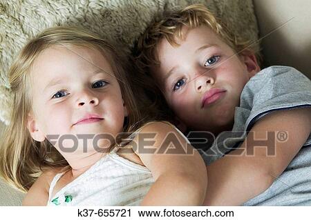 5 y/o boy with his 4 y/o sister on sofa. Siblings. View Large Photo Image Stock Image - 5 y/o boy with his 4 y/o sister on sofa. Siblings.. Fotosearch