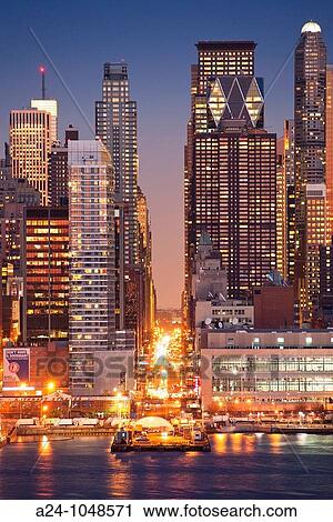 Stock Image - 57th Street, Midtown Manhattan skyline across Hudson River from New Jersey, New York City, USA. Fotosearch