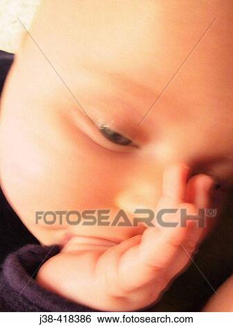 6 month old baby boy sucking thumb View Large Photo Image Stock Photograph - 6 month old baby boy sucking thumb. Fotosearch