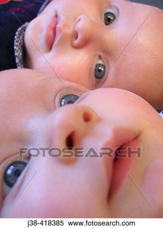 Stock Photography - 6 month old twins. Fotosearch