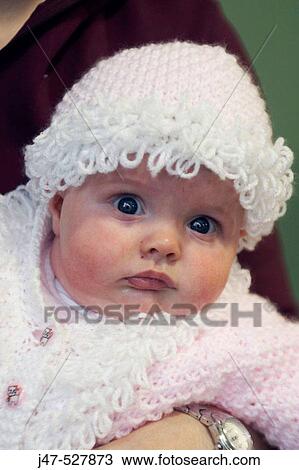 6 week old baby looking into camera wearing a bobbly hat and cardigan View Large Photo Image Stock Image - 6 week old baby looking into camera wearing a bobbly hat and cardigan. Fotosearch
