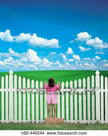 6 year old girl at fence. View Large Photo Image Picture - 6 year old girl at fence.. Fotosearch