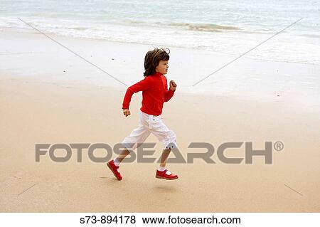 6 year old girl running on beach View Large Photo Image Stock Photo - 6 year old girl running on beach. Fotosearch