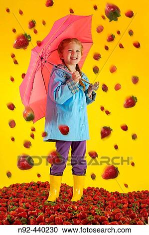 6 year old girl with strawberry rain. View Large Photo Image Stock Image - 6 year old girl with strawberry rain.. Fotosearch