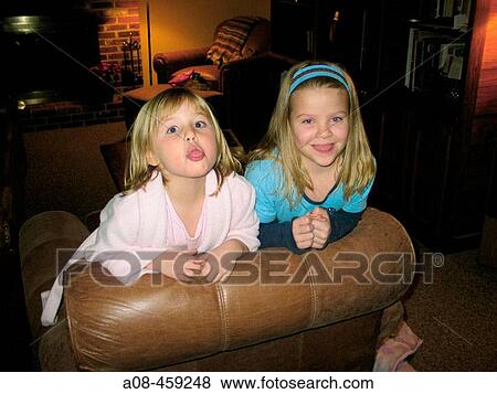 6 year old girls react to being photographed by sticking their tongues out at camera View Large Photo Image Stock Photo - 6 year old girls react to being photographed by sticking their tongues out at camera. Fotosearch