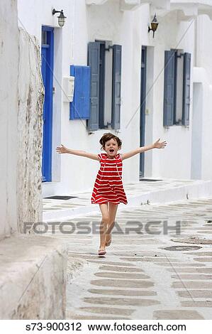 6 years old girl running in a Mykonos street, Cyclades islands, Greece, Europe View Large Photo Image Stock Image - 6 years old girl running in a Mykonos street, Cyclades islands, Greece, Europe. Fotosearch