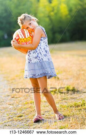 6 years old girl with her most beloved ball View Large Photo Image Stock Photo - 6 years old girl with her most beloved ball. Fotosearch