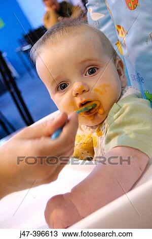 7 month old baby being fed babyfood, in a highchair View Large Photo Image Stock Image - 7 month old baby being fed babyfood, in a highchair. Fotosearch