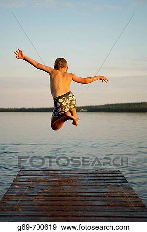 7 year old boy and jumping from a jetty, Norrbotten, Sweden (July 2005) View Large Photo Image Stock Photo - 7 year old boy and jumping from a jetty, Norrbotten, Sweden (July 2005). Fotosearch