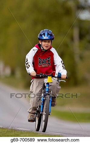 7 year old boy bicycle on a road, Vasterbotten, Sweden (June 2005) View Large Photo Image Stock Photo - 7 year old boy bicycle on a road, Vasterbotten, Sweden (June 2005). Fotosearch