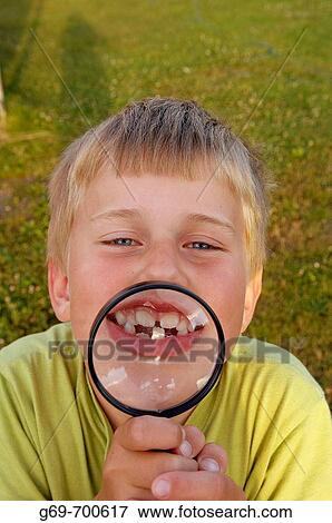 7 year old boy with a magnifying glass, Vasterbotten, Sweden (June 2005) View Large Photo Image Stock Photo - 7 year old boy with a magnifying glass, Vasterbotten, Sweden (June 2005). Fotosearch