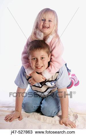 7 year old boy with his 4 year old sister sitting on his back laughing into camera View Large Photo Image Stock Image - 7 year old boy with his 4 year old sister sitting on his back laughing into camera. Fotosearch
