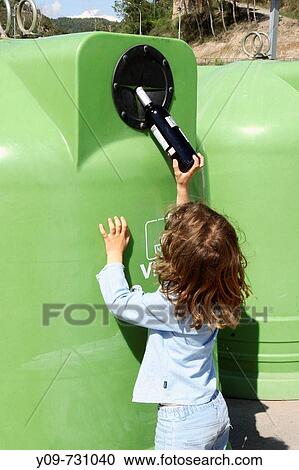 7 year old girl throwing a bottle in a recycling bin View Large Photo Image Stock Image - 7 year old girl throwing a bottle in a recycling bin. Fotosearch
