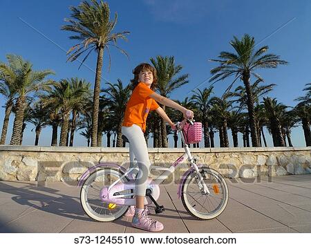 7 years old girl on bicycle in Torremolinos, MBlaga, Andaluc? a, Spain View Large Photo Image Stock Image - 7 years old girl on bicycle in Torremolinos, MBlaga, Andaluc? a, Spain. Fotosearch
