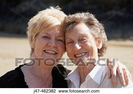 75 and 69 year old sisters standing together smiling, headshot. View Large Photo Image Stock Image - 75 and 69 year old sisters standing together smiling, headshot.. Fotosearch