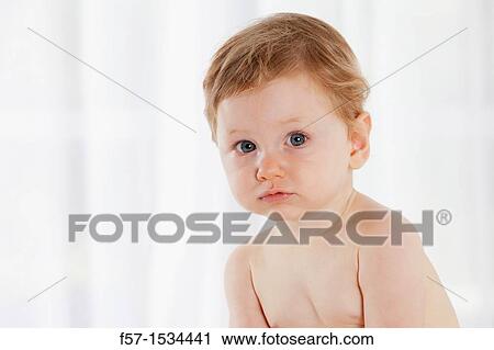 Stock Image - 8 month old baby boy. Fotosearch