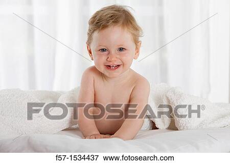 Stock Photo - 8 month old baby boy. Fotosearch