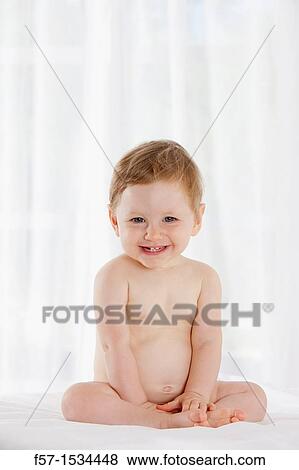 Stock Photo - 8 month old baby boy. Fotosearch
