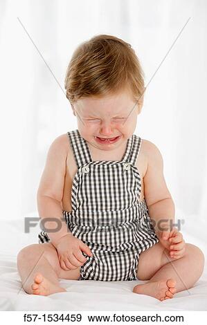 Stock Photo - 8 month old baby boy. Fotosearch