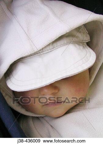 8 month old baby boy wearing a cap and hood View Large Photo Image Stock Photo - 8 month old baby boy wearing a cap and hood. Fotosearch