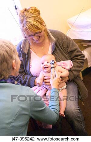8 week old baby at doctors surgery, having her first health check-up View Large Photo Image Stock Image - 8 week old baby at doctors surgery, having her first health check-up. Fotosearch