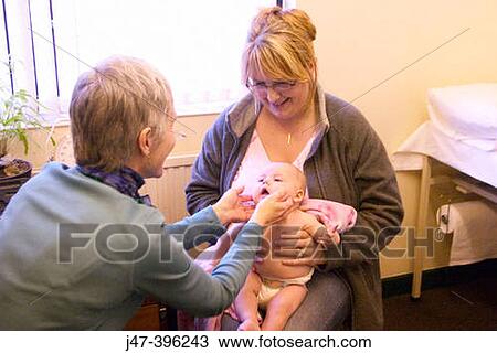 8 week old baby at doctors surgery, having her first health check-up View Large Photo Image Stock Image - 8 week old baby at doctors surgery, having her first health check-up. Fotosearch