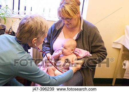 8 week old baby at doctors surgery, having her first health check-up with the doctor View Large Photo Image Stock Photo - 8 week old baby at doctors surgery, having her first health check-up with the doctor. Fotosearch