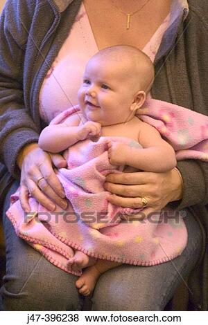 8 week old baby on mothers knee View Large Photo Image Stock Photo - 8 week old baby on mothers knee. Fotosearch